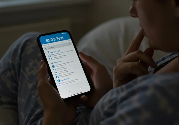 Woman taking online EPDS test on a smartphone